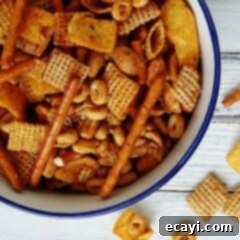Fiesta Taco Chex Mix 2 A close up overhead photo of a bowl of taco chex mix, showing the crunchy texture and spice.