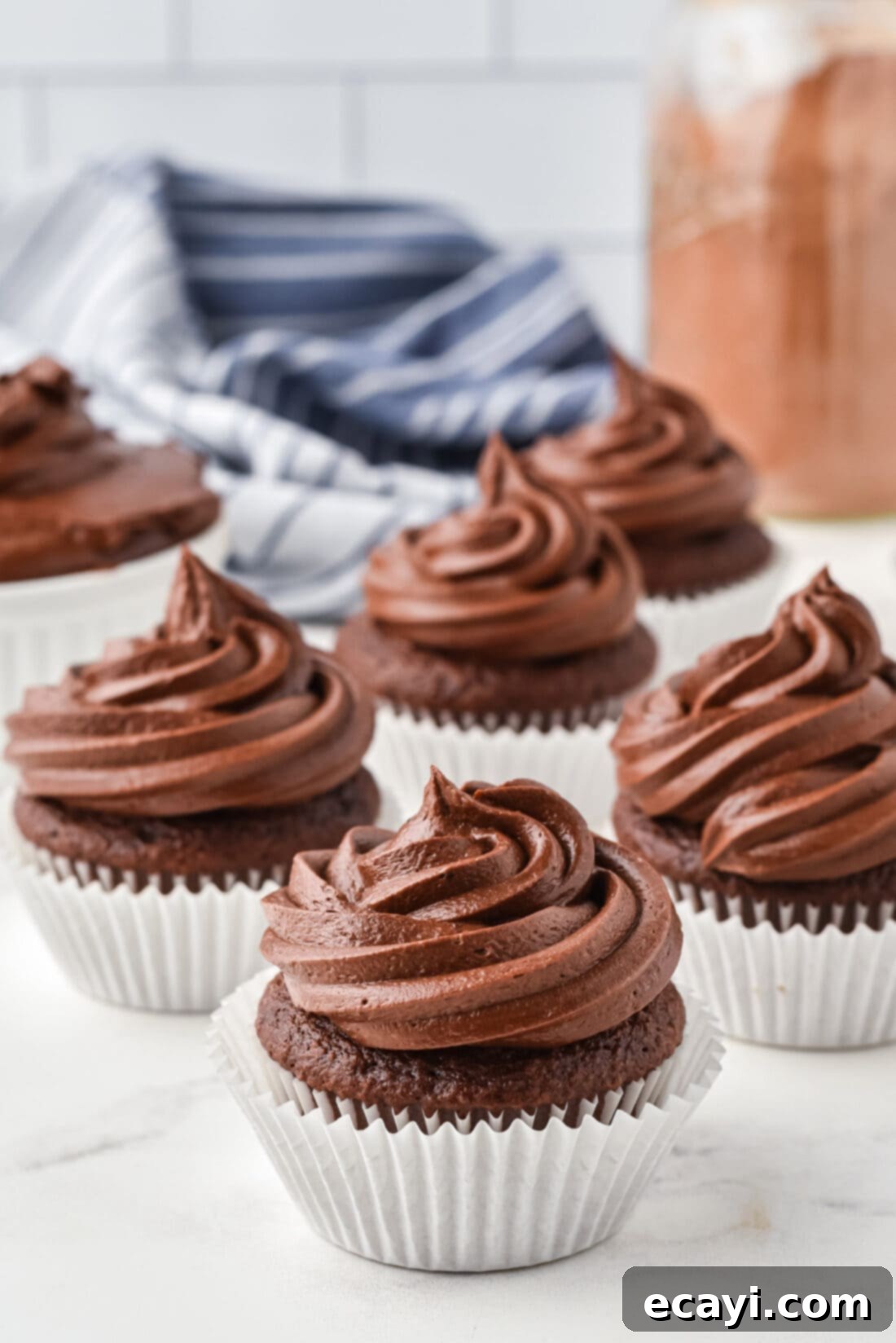 Velvet Chocolate Fudge Bliss 7 Delicious chocolate fudge frosted cupcakes, ready to be enjoyed