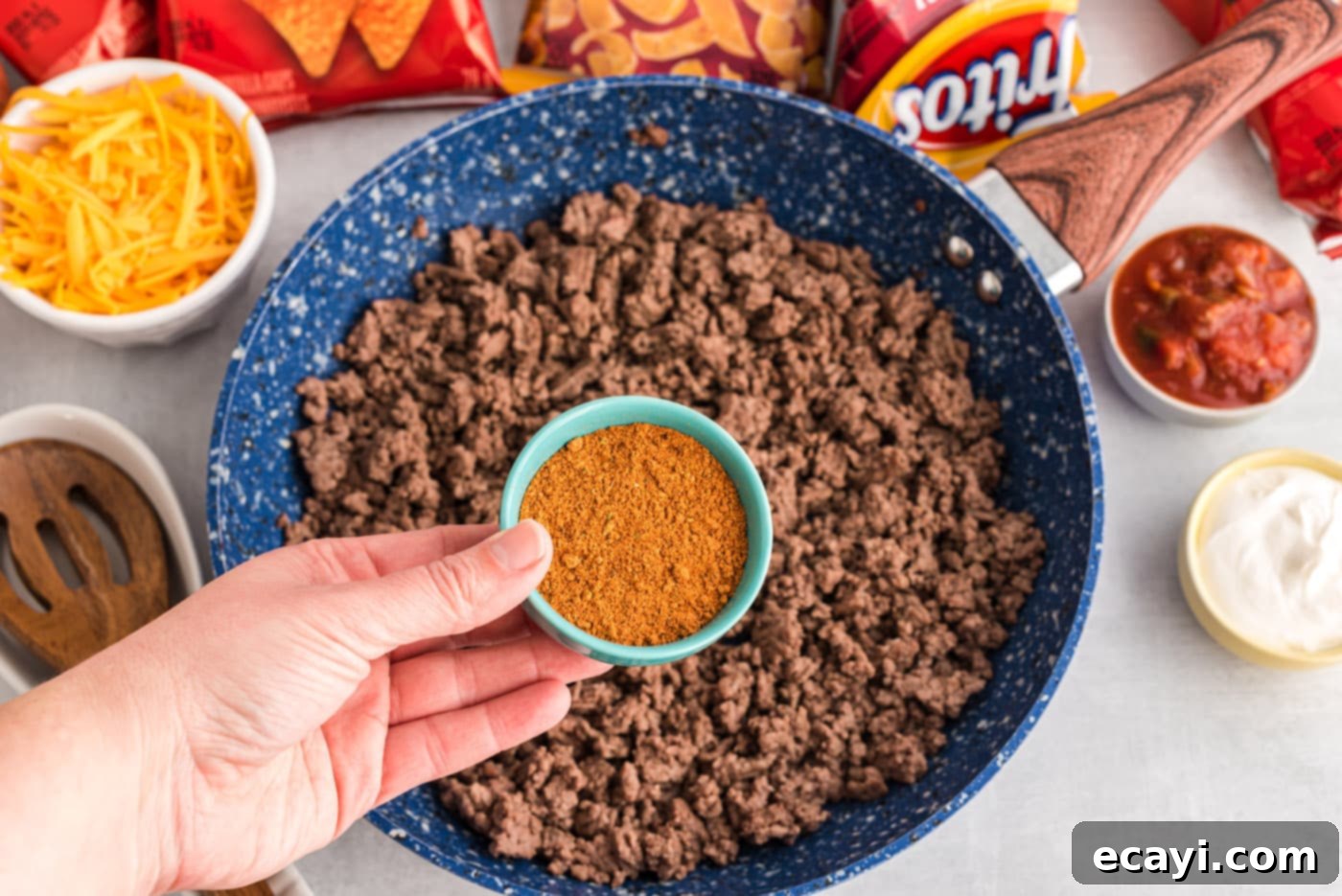 Portable Taco Crunch 5 Ground beef and taco seasoning simmering in a skillet