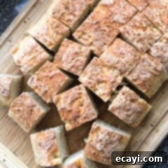 The Everyday Hearth Bread 11 squares of peasant bread on cutting board