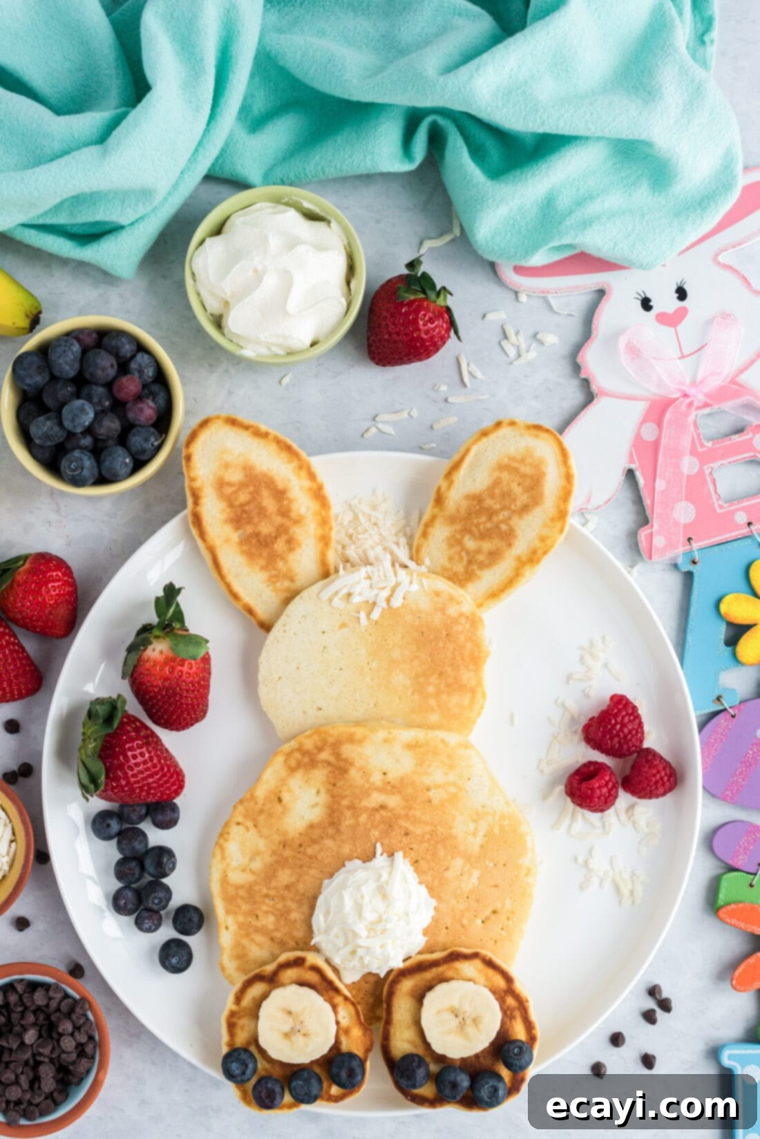 Fluffy Cottontail Stacks 2 Bunny Butt Pancakes served with fruit and whipped cream for Easter breakfast
