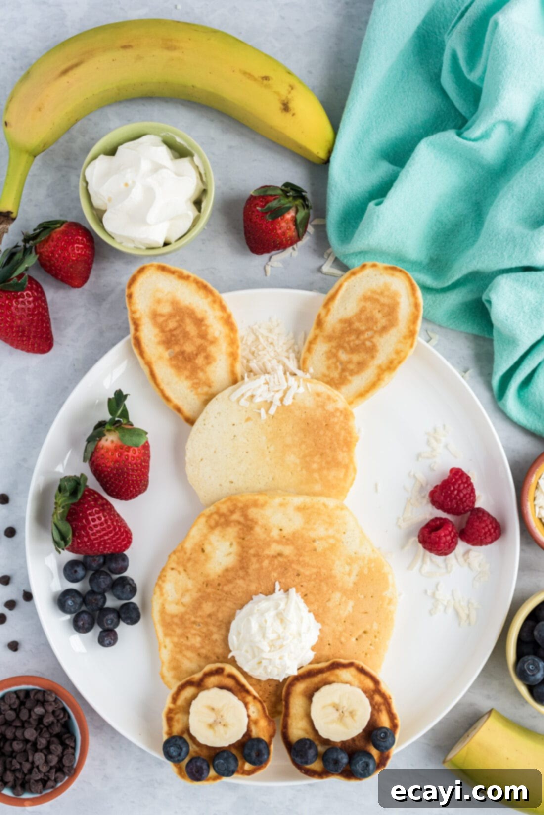 Fluffy Cottontail Stacks 11 Bunny Butt Pancakes on a plate with fresh berries