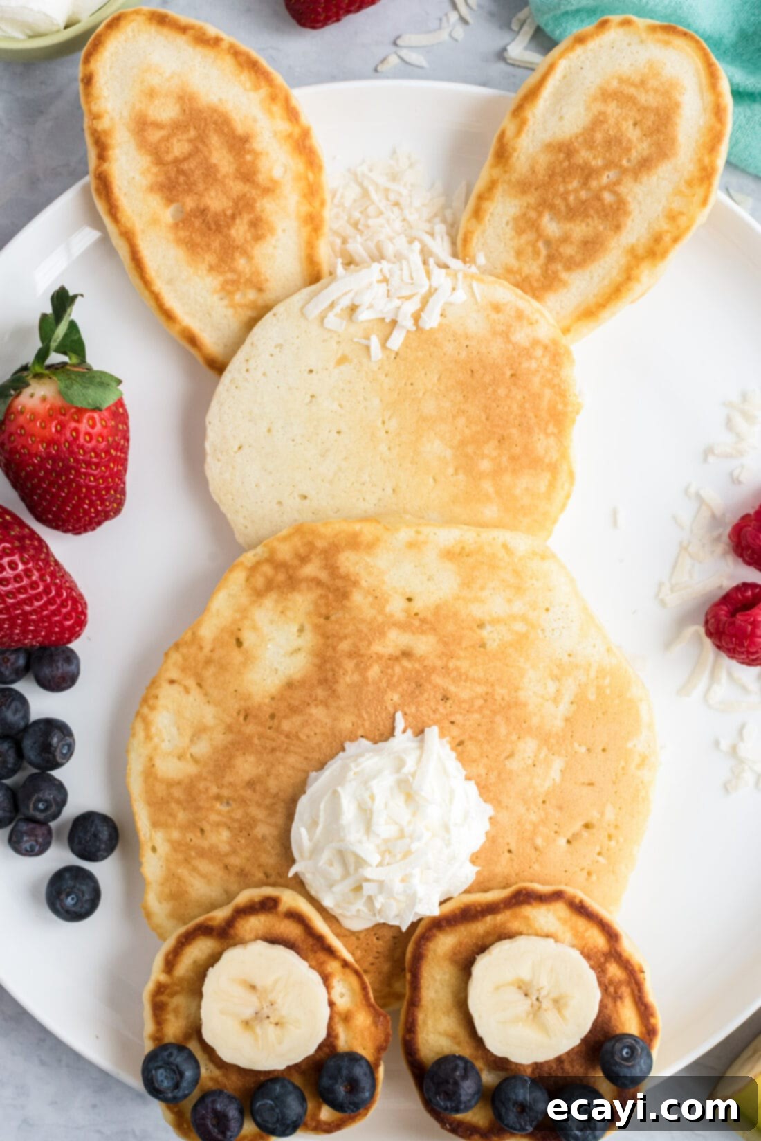 Fluffy Cottontail Stacks 3 close up of Bunny Butt Pancakes showing detail of fruit and whipped cream