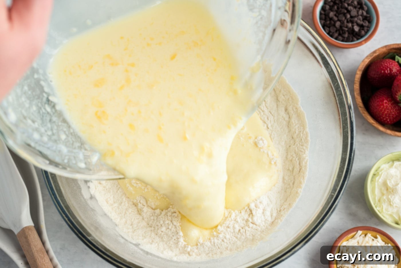 Fluffy Cottontail Stacks 7 adding wet ingredients to dry pancake ingredients