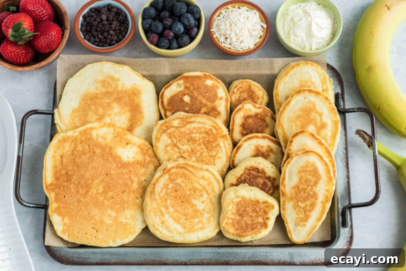 Fluffy Cottontail Stacks 9 pancakes on a baking sheet to keep warm