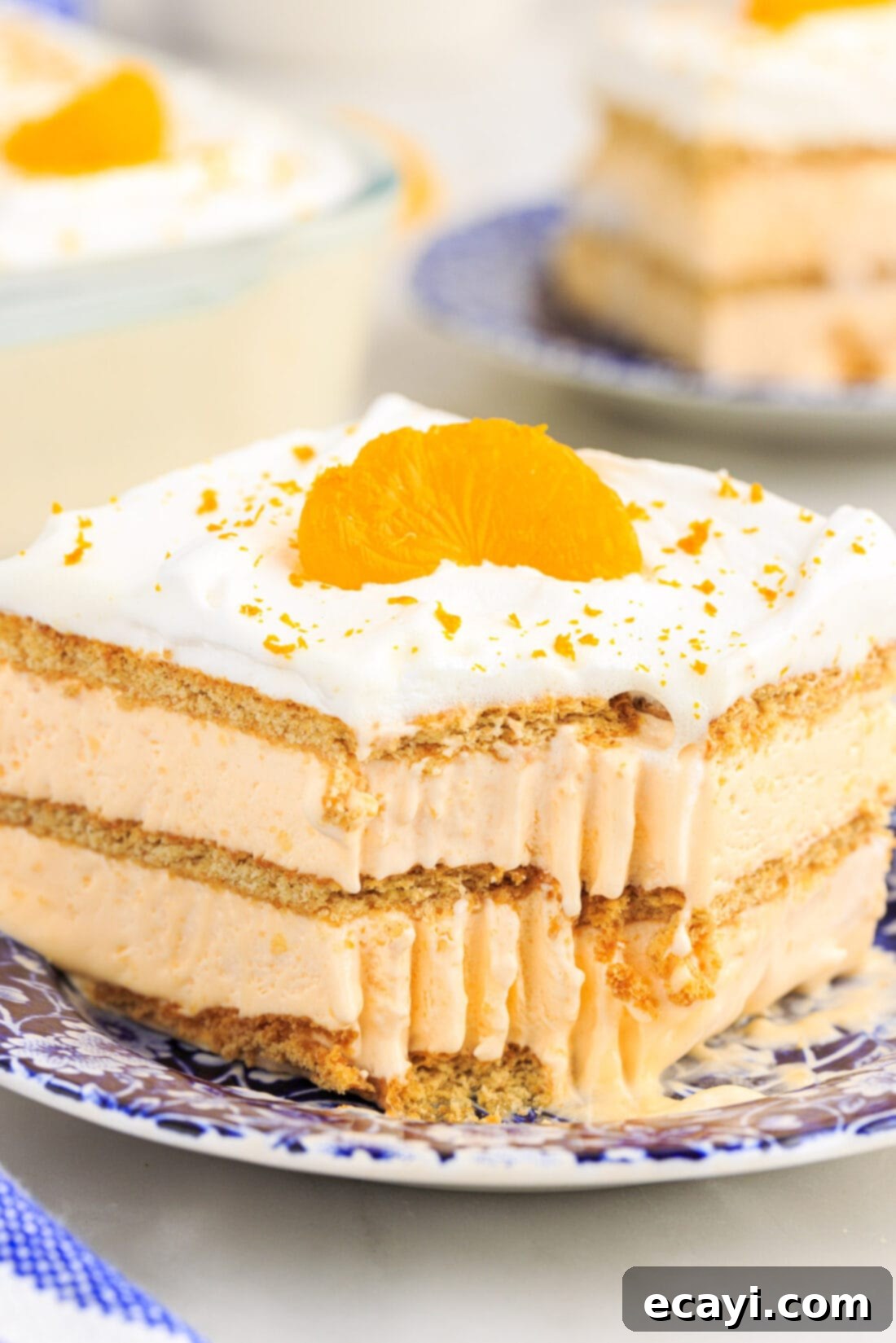 Orange Dreamsicle Delight 2 slice of Orange Icebox Cake with bite out of it