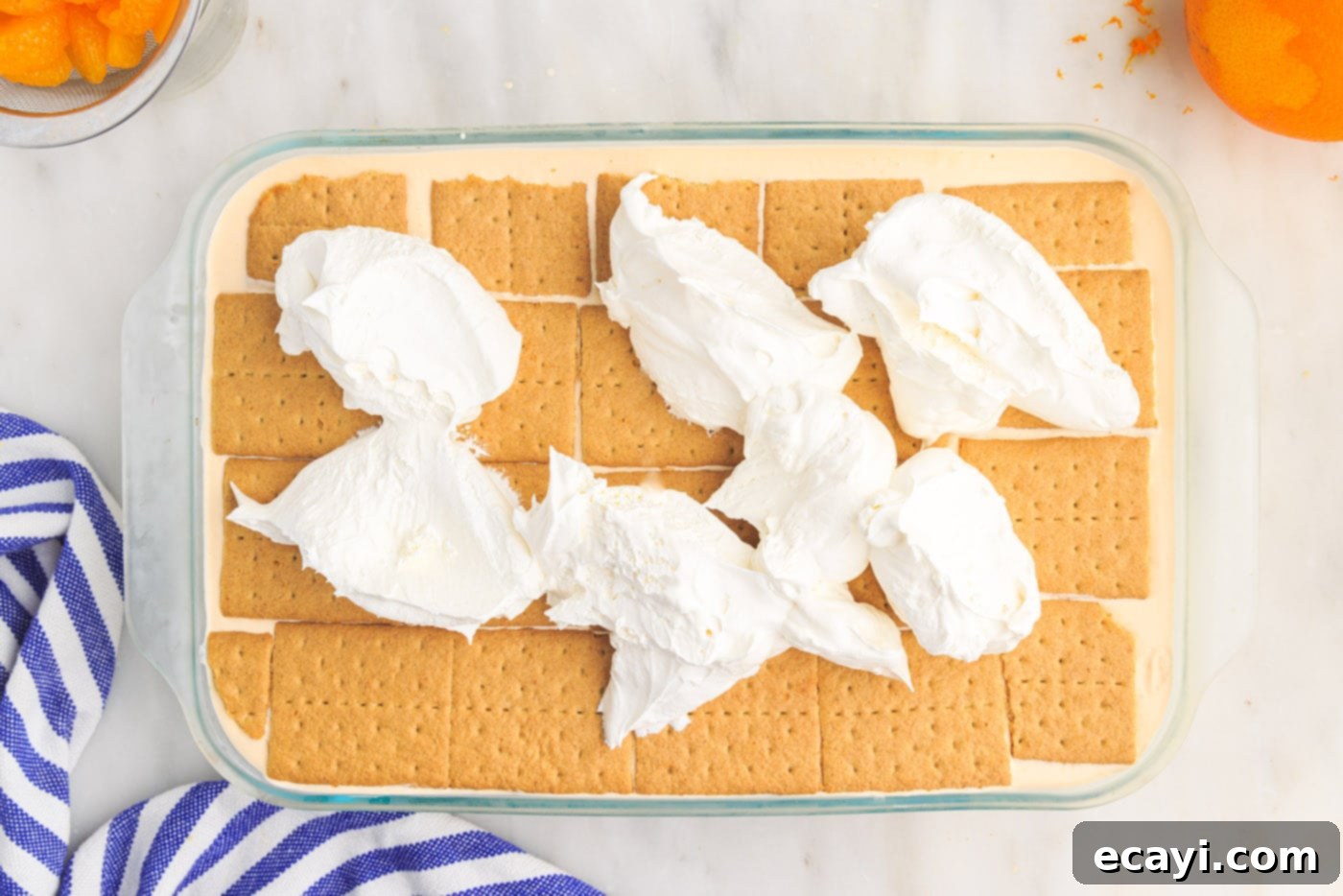 Orange Dreamsicle Delight 17 whipped cream on top of orange icebox cake