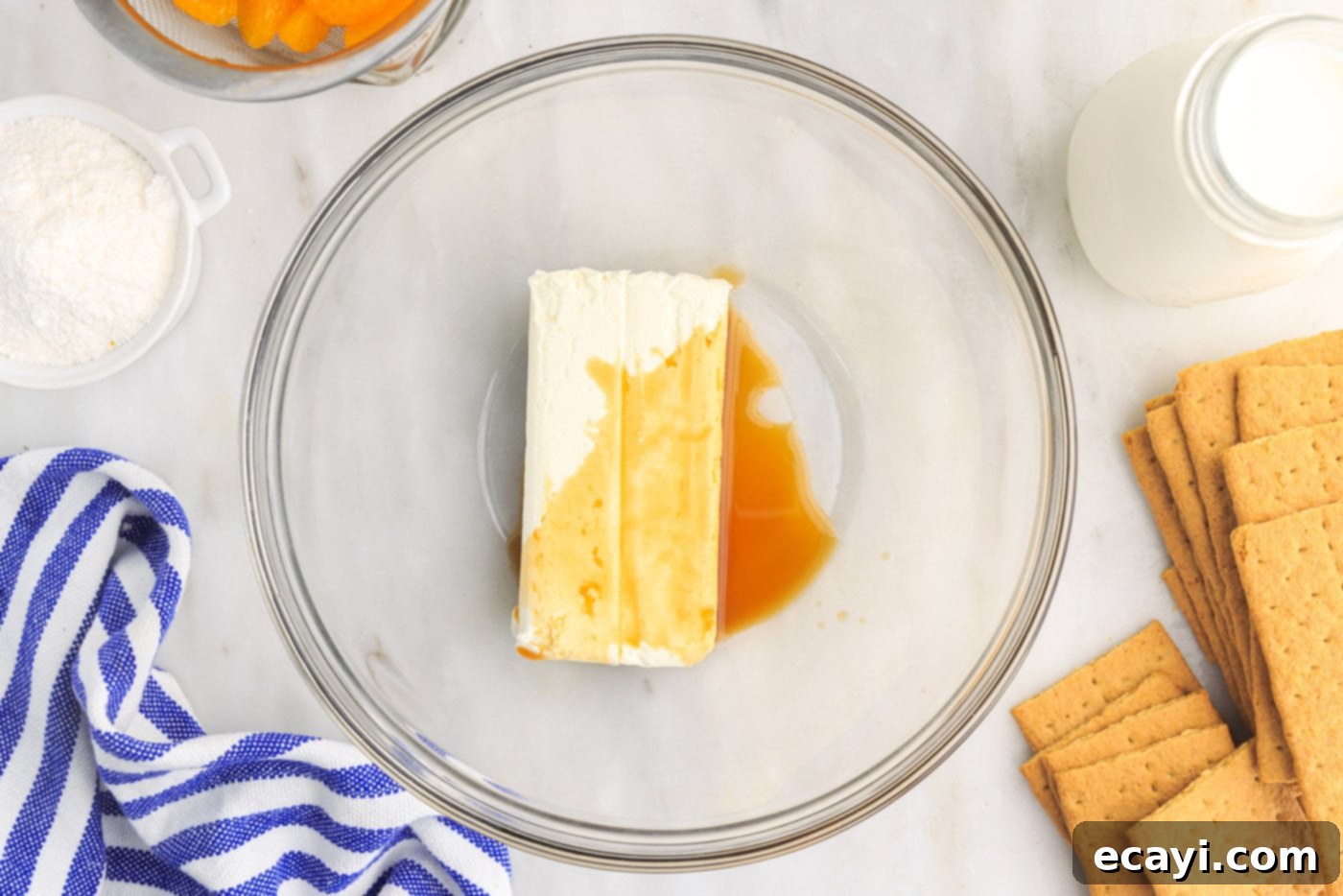 Orange Dreamsicle Delight 7 cream cheese and vanilla extract in mixing bowl