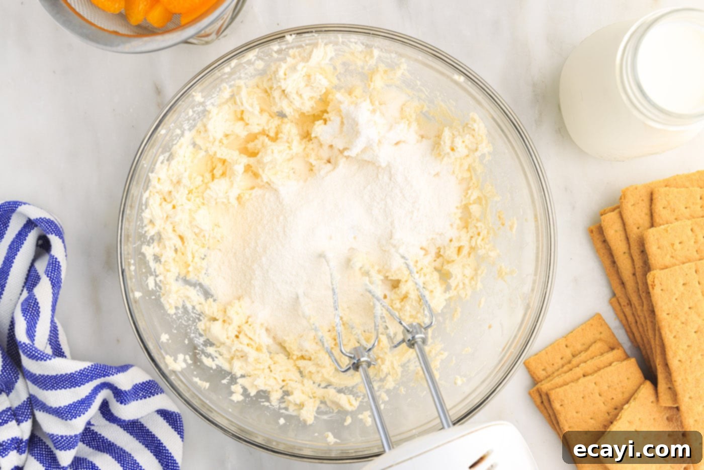 Orange Dreamsicle Delight 8 pudding mix with cream cheese in a bowl
