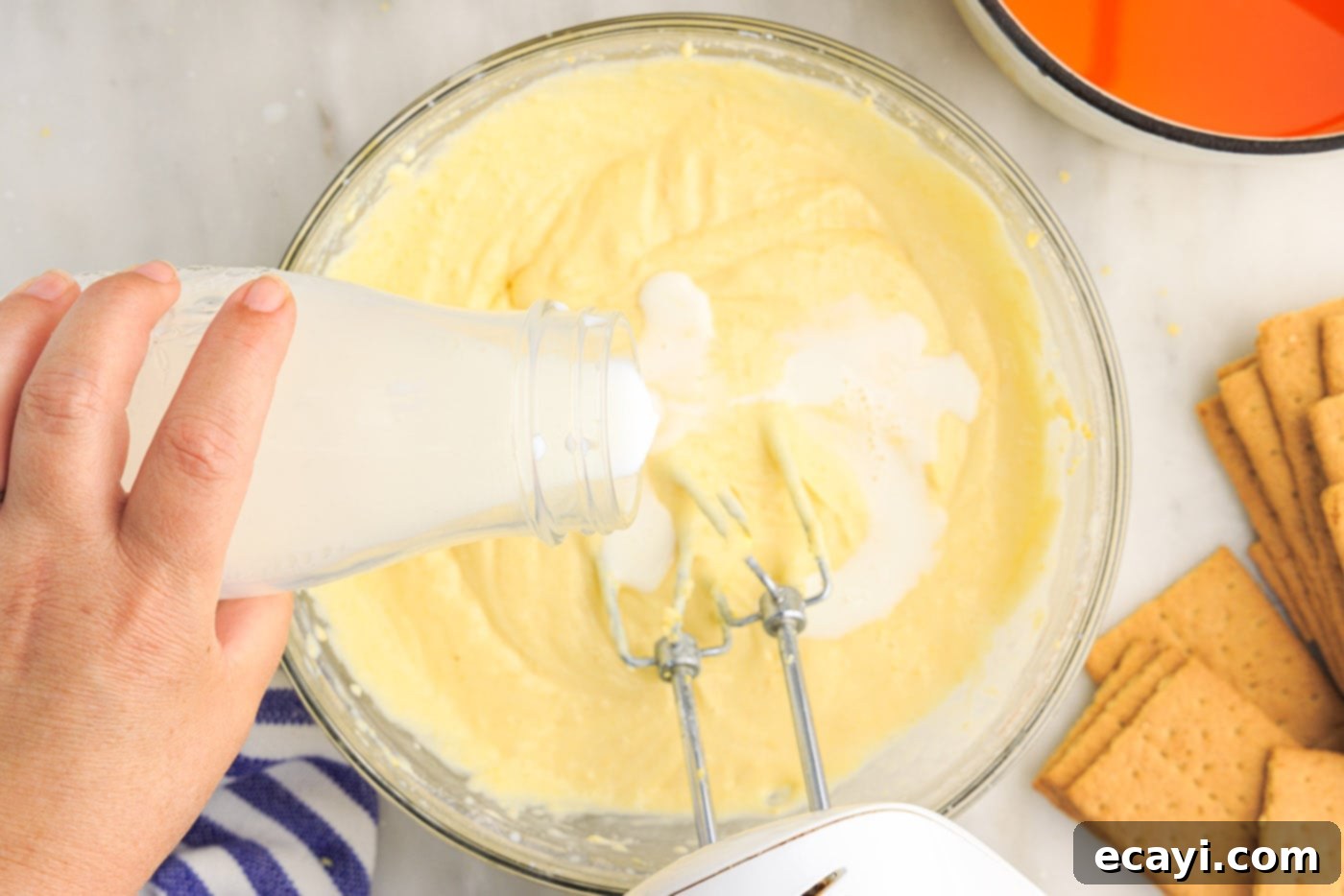 Orange Dreamsicle Delight 9 pouring milk into cream cheese mix