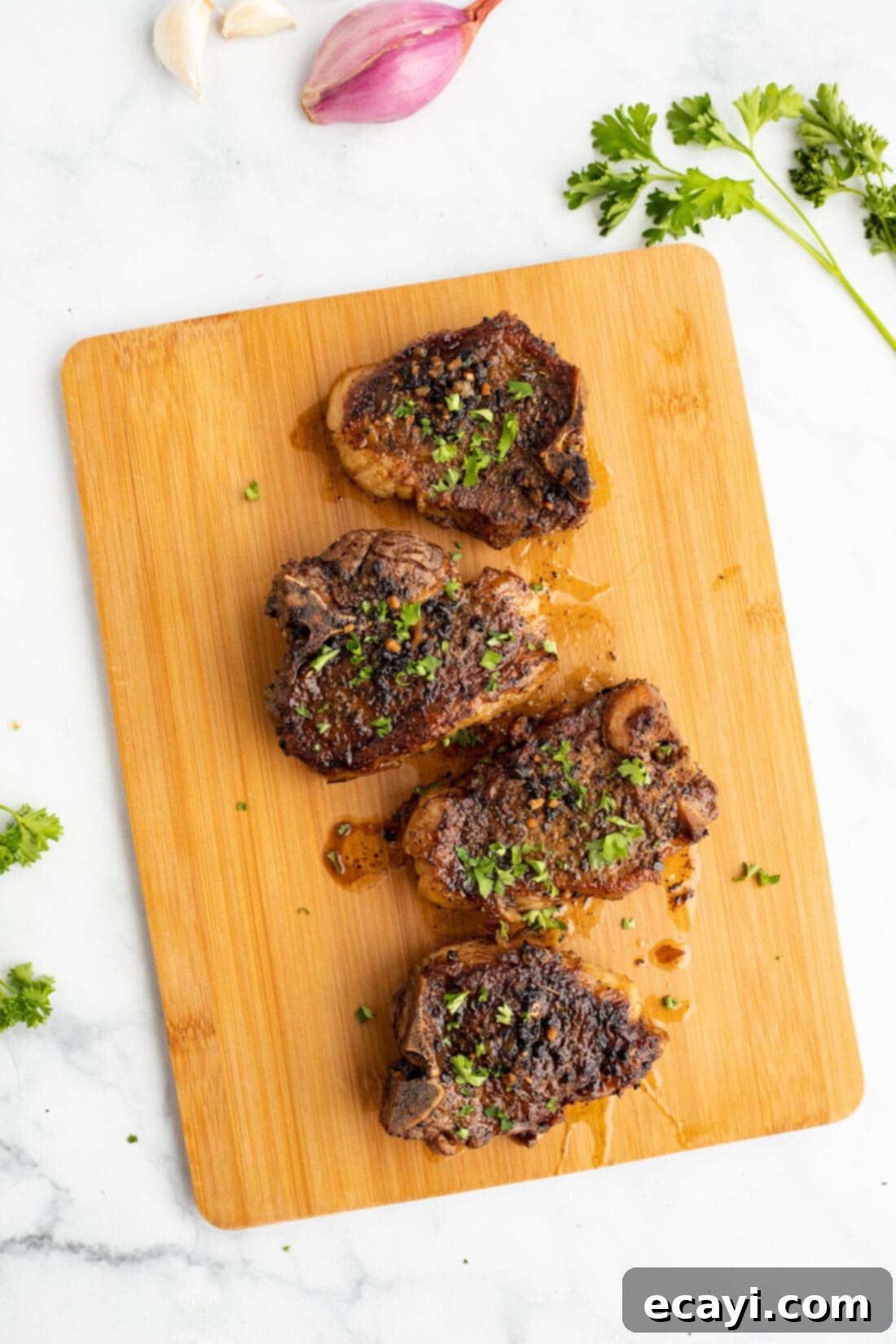 Succulent Herb-Crusted Lamb Chops 2 Succulent Lamb Chops on a cutting board, ready to be served