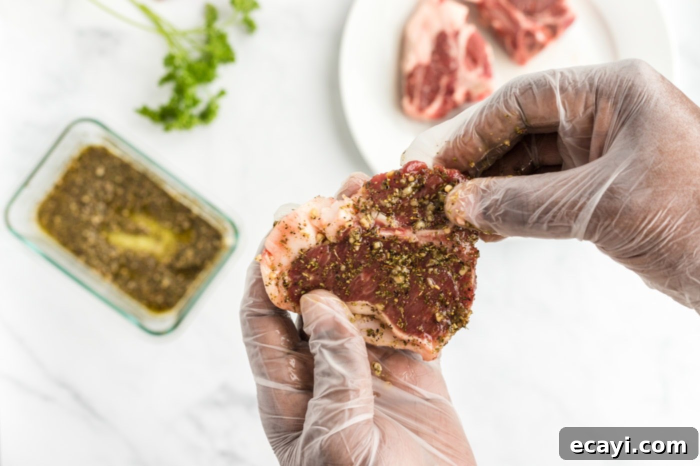 Succulent Herb-Crusted Lamb Chops 6 Massaging the rub into lamb chops for maximum flavor