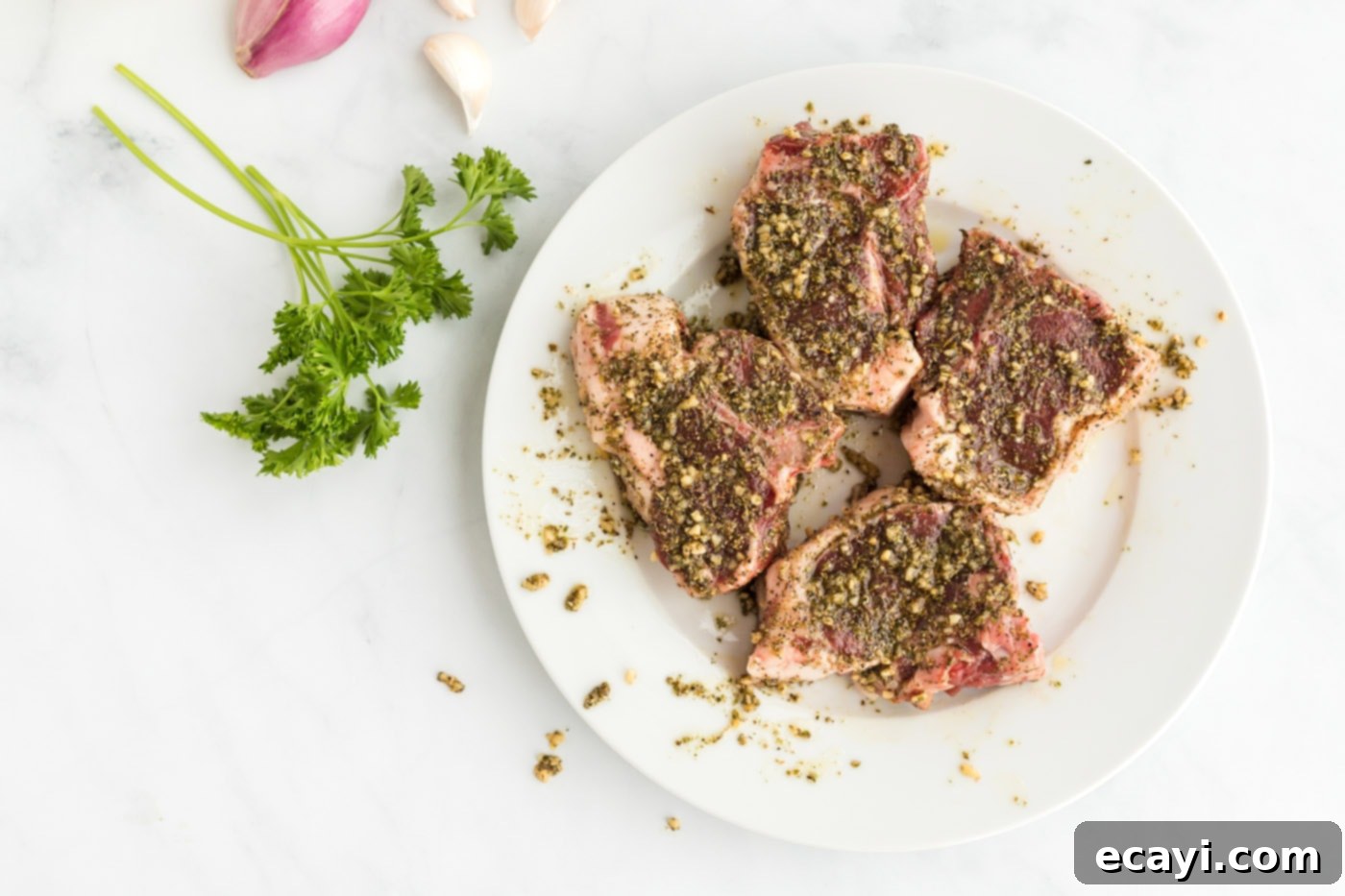 Succulent Herb-Crusted Lamb Chops 7 Lamb chops seasoned with the wet rub, ready for searing