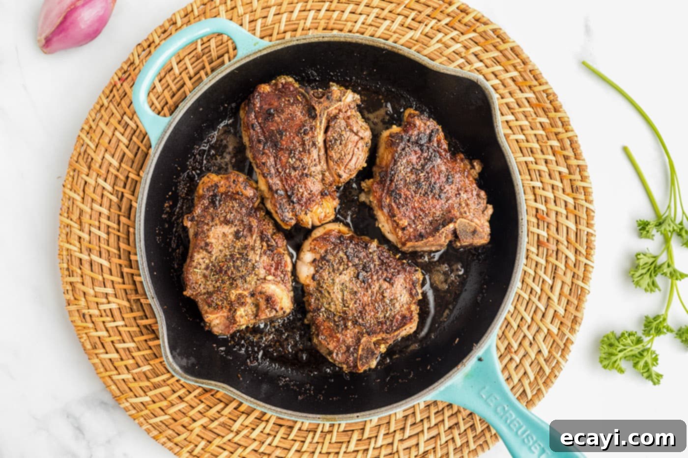 Succulent Herb-Crusted Lamb Chops 8 Searing lamb chops in a hot skillet for a golden crust
