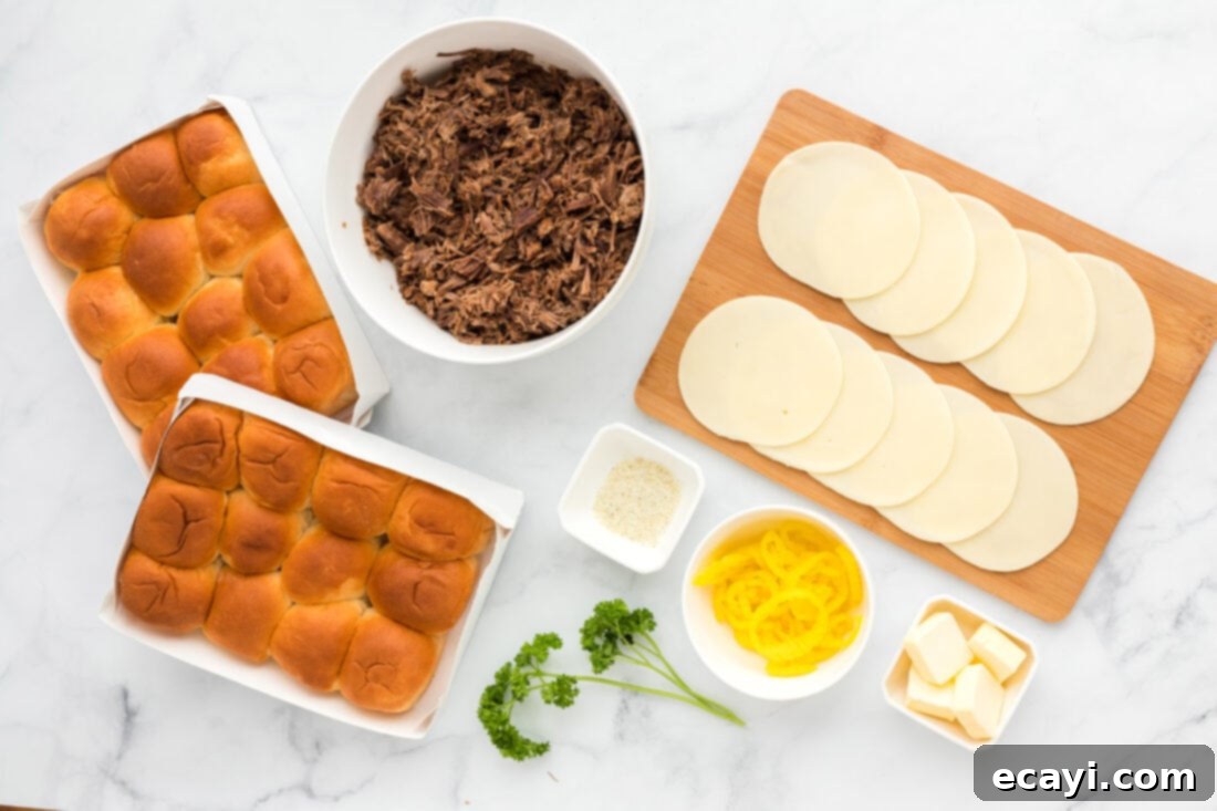 Slow Cooker Mississippi Pot Roast Sliders 4 All the raw ingredients laid out for making Mississippi Pot Roast Sliders: Hawaiian rolls, provolone cheese, pepperoncini peppers, butter, and garlic salt.