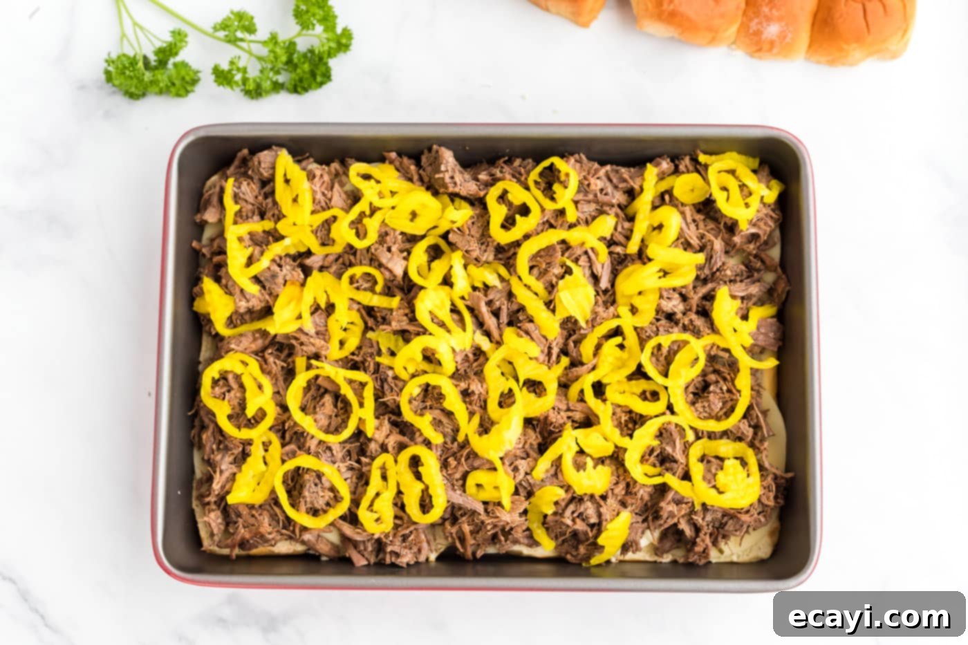Slow Cooker Mississippi Pot Roast Sliders 9 Sliced pepperoncini peppers sprinkled over the Mississippi pot roast and cheese layer.