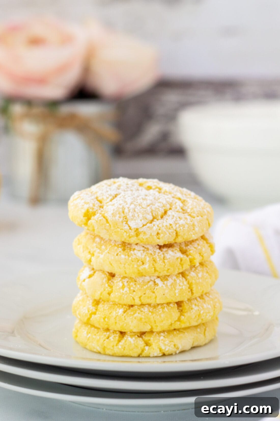 Bright Lemon Cake Mix Cookies 2 Stack of freshly baked lemon cake mix cookies with powdered sugar