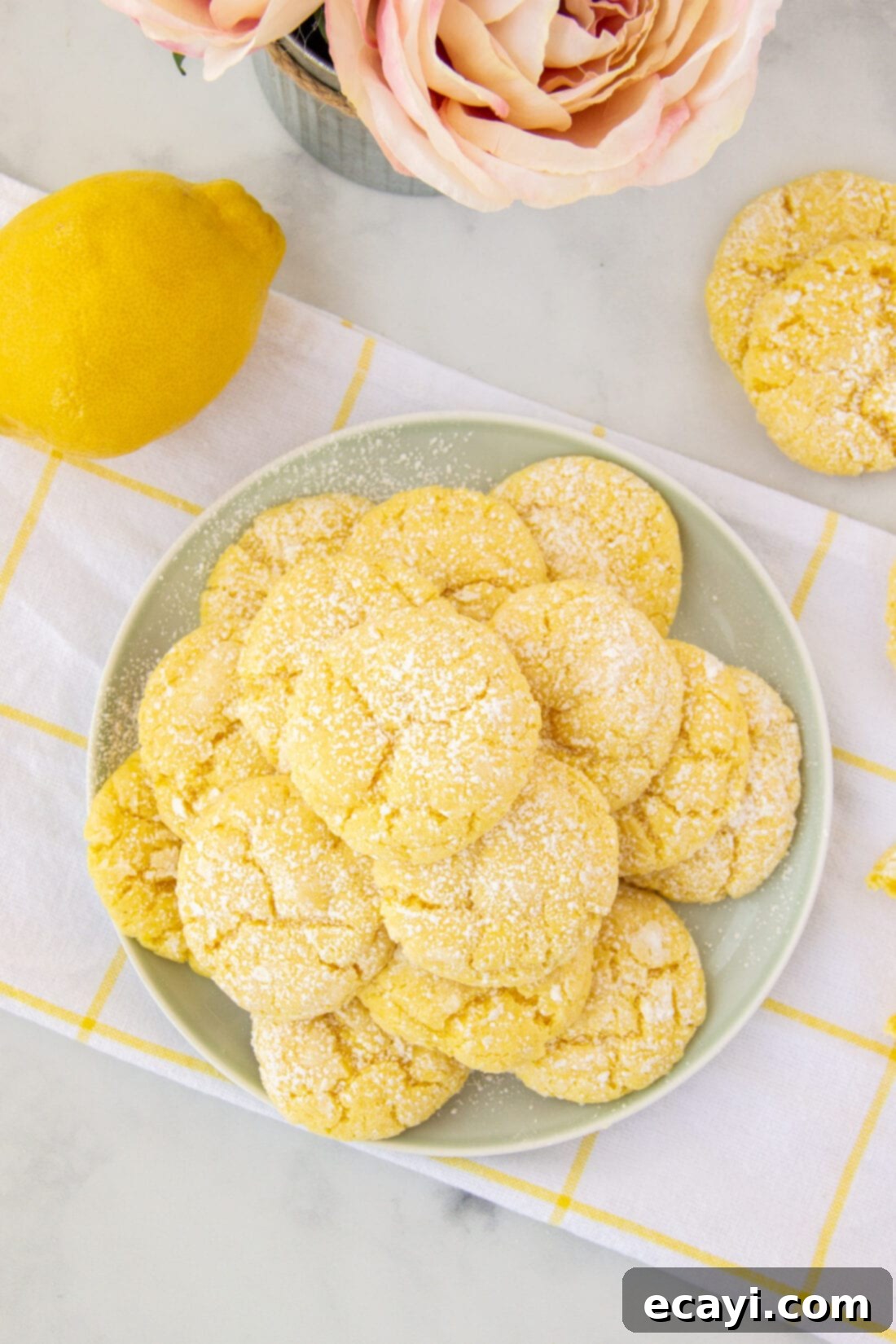 Bright Lemon Cake Mix Cookies 13 Plate of bright yellow lemon cake mix cookies dusted with powdered sugar