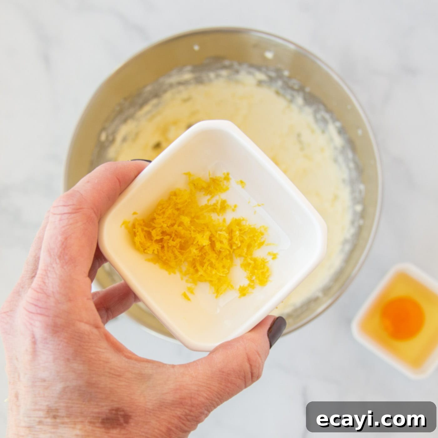 Bright Lemon Cake Mix Cookies 7 Lemon zest being added to the wet cookie ingredients