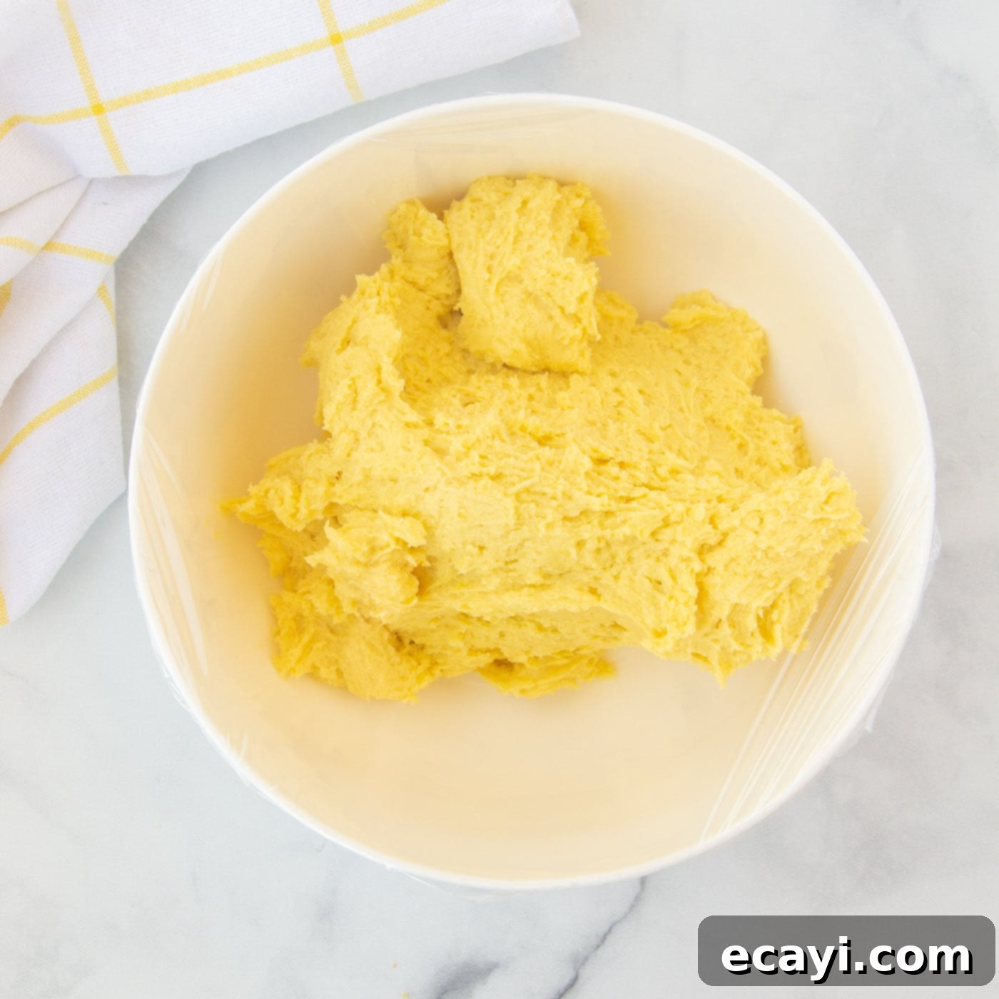 Bright Lemon Cake Mix Cookies 10 Lemon cake mix cookie dough in a bowl, covered with plastic wrap, chilling