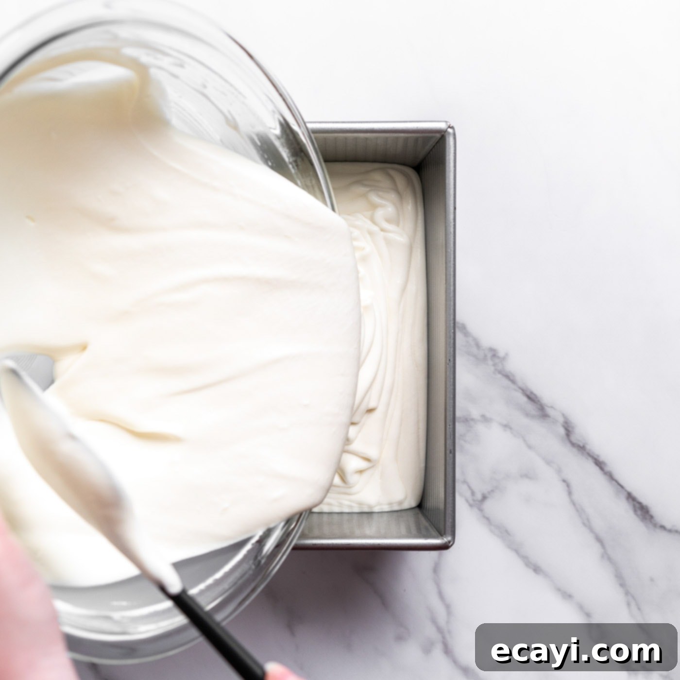No-Fuss Creamy Ice Cream 11 Pouring the no-churn ice cream mixture into a chilled loaf pan