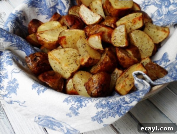 Crispy Roasted Potatoes as a Side A close up photo of beautifully cut and roasted potatoes, seasoned and golden brown, ready as a side dish.