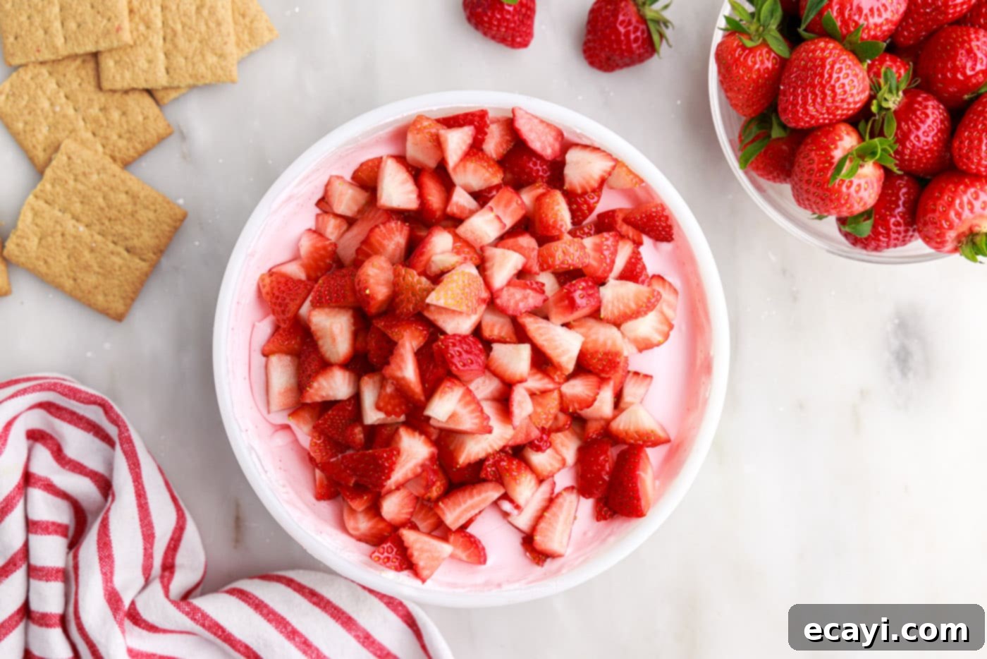 Strawberry Tiered Trifle 12 chopped strawberries over strawberry gelatin mixture