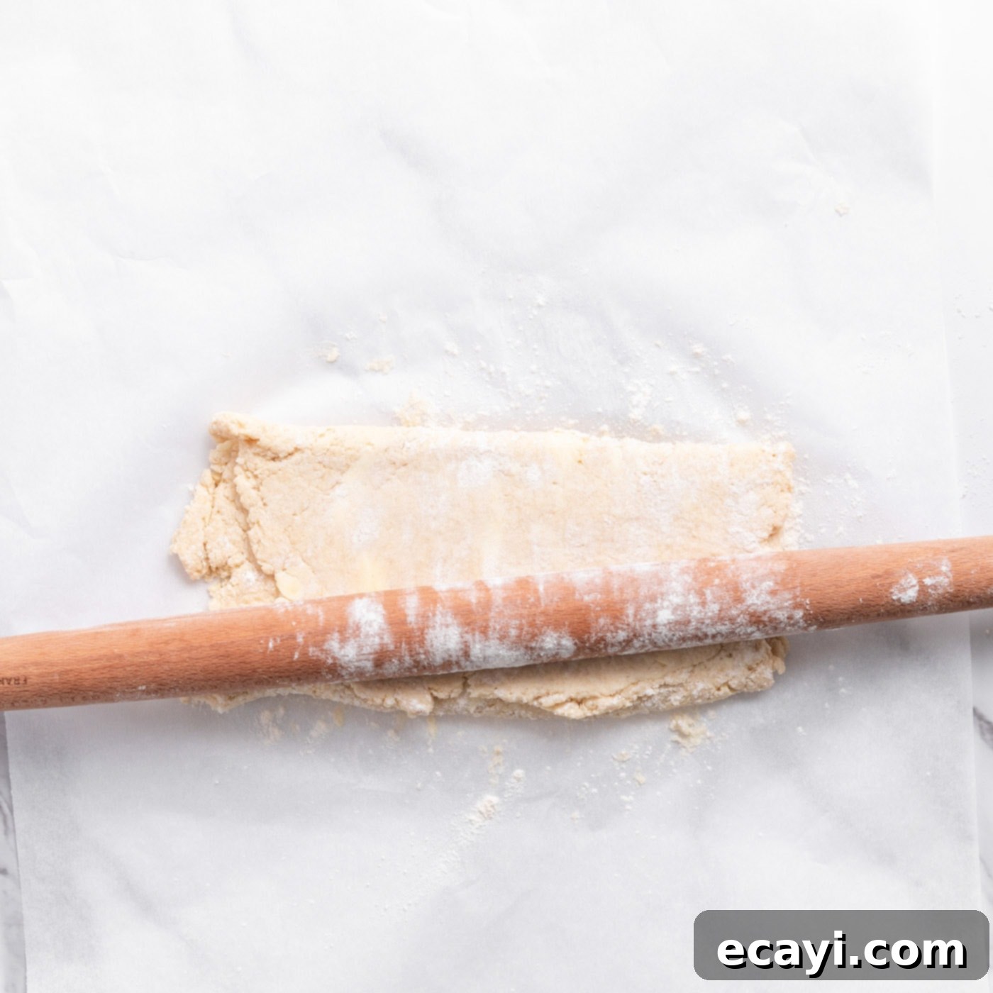 Garden Fresh Strawberry Shortcake 11 Floured rolling pin pressing biscuit dough, showing the layering process