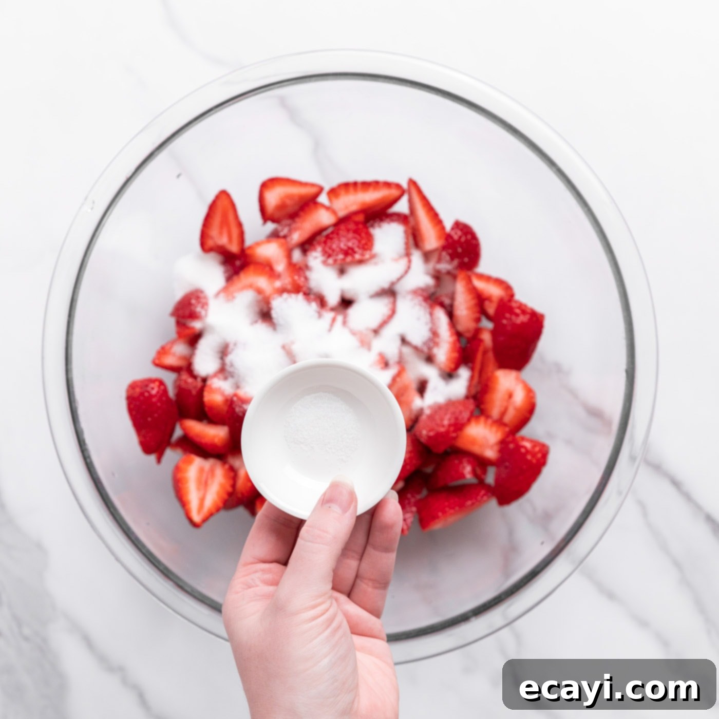 Garden Fresh Strawberry Shortcake 5 Chopped fresh strawberries sprinkled with sugar in a bowl, beginning to macerate