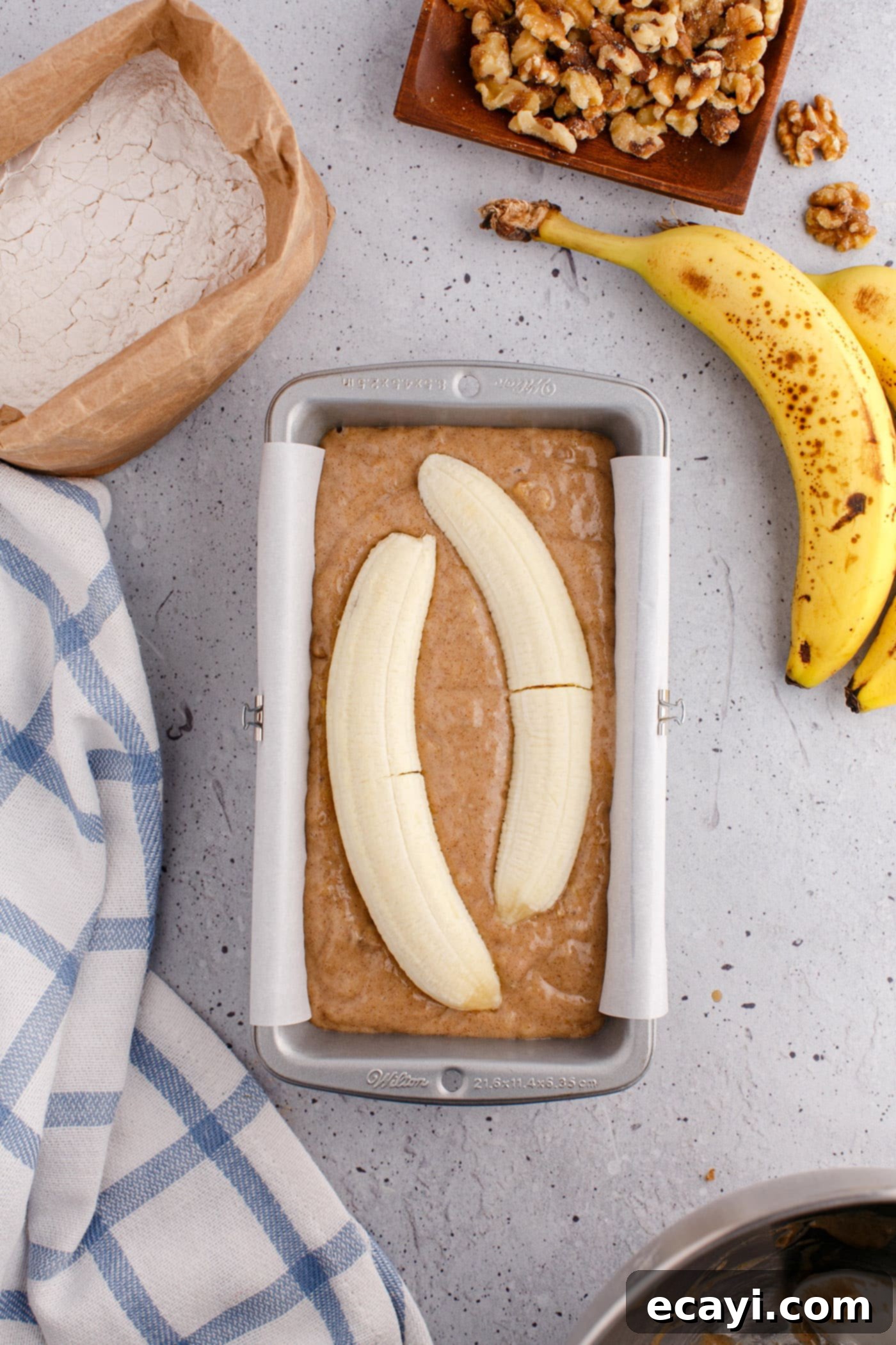 Homestyle Banana Nut Delight 11 banana slice on top of banana bread batter