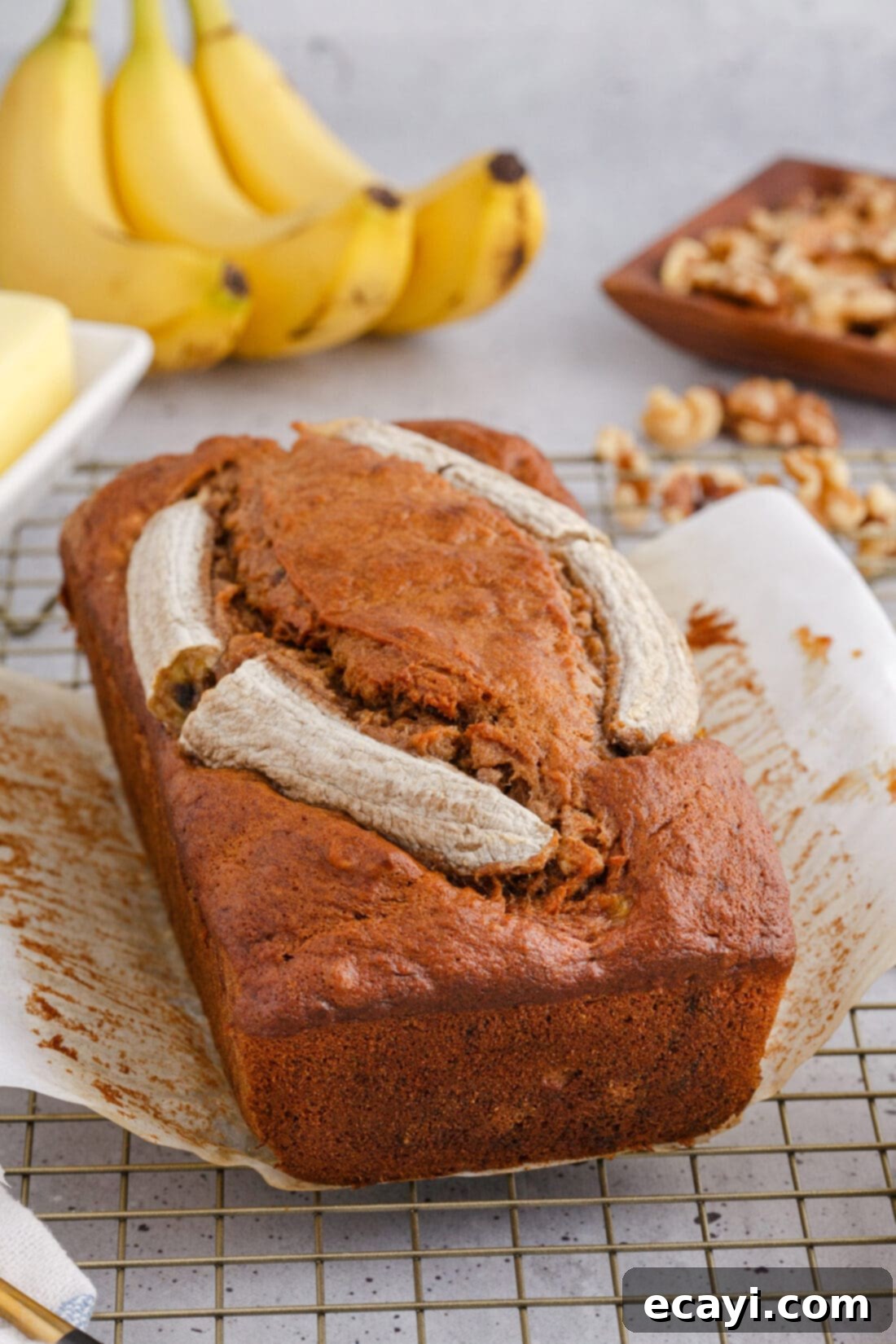 Homestyle Banana Nut Delight 12 Banana Nut Bread with bananas in the background