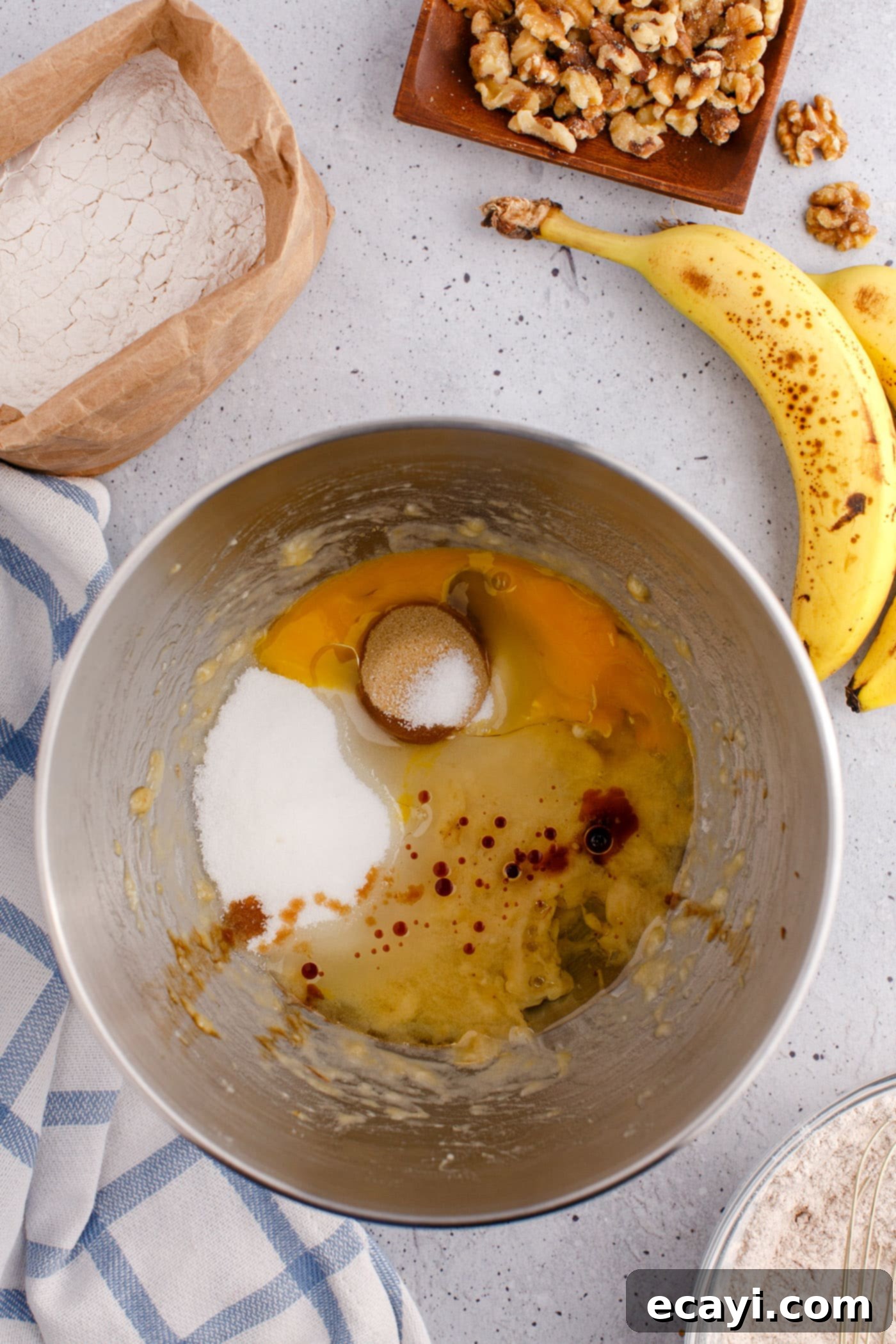 Homestyle Banana Nut Delight 7 wet ingredients for banana nut bread in a mixing bowl