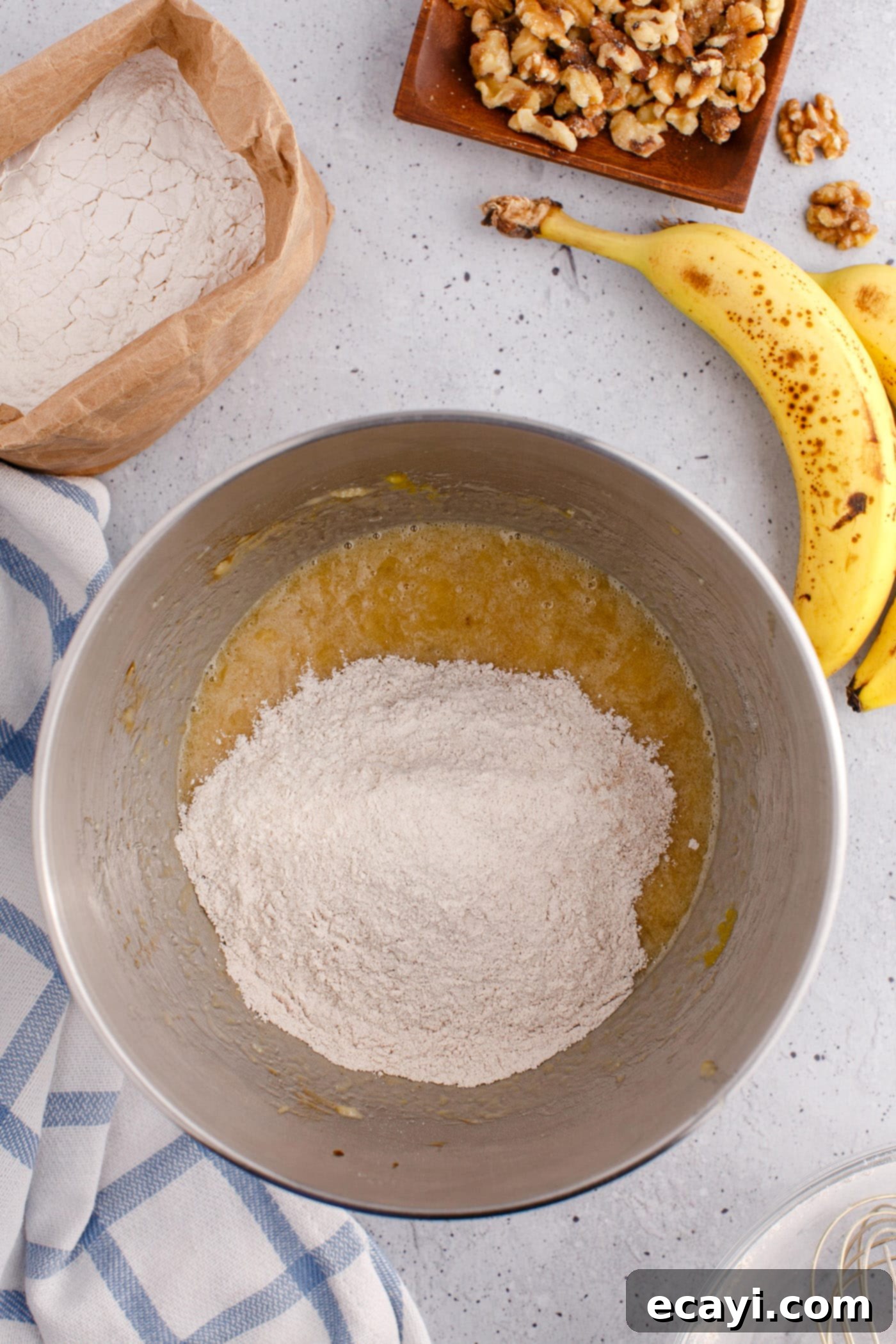 Homestyle Banana Nut Delight 8 flour mixture in bowl of banana bread ingredients