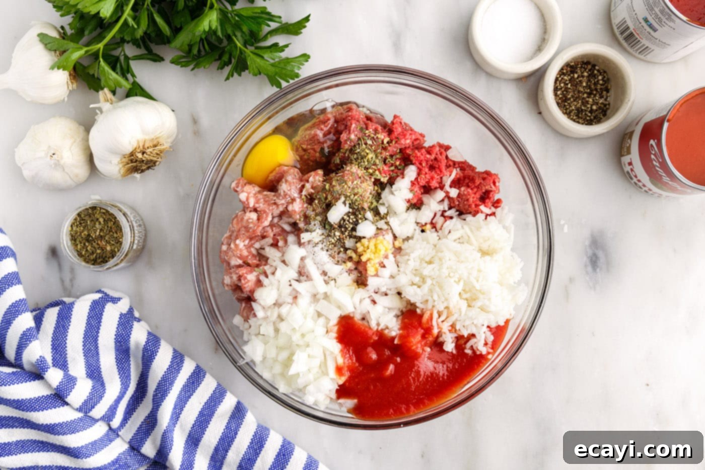 Stuffed Cabbage Delights 6 ground beef and sausage in a bowl with seasonings, egg, and rice