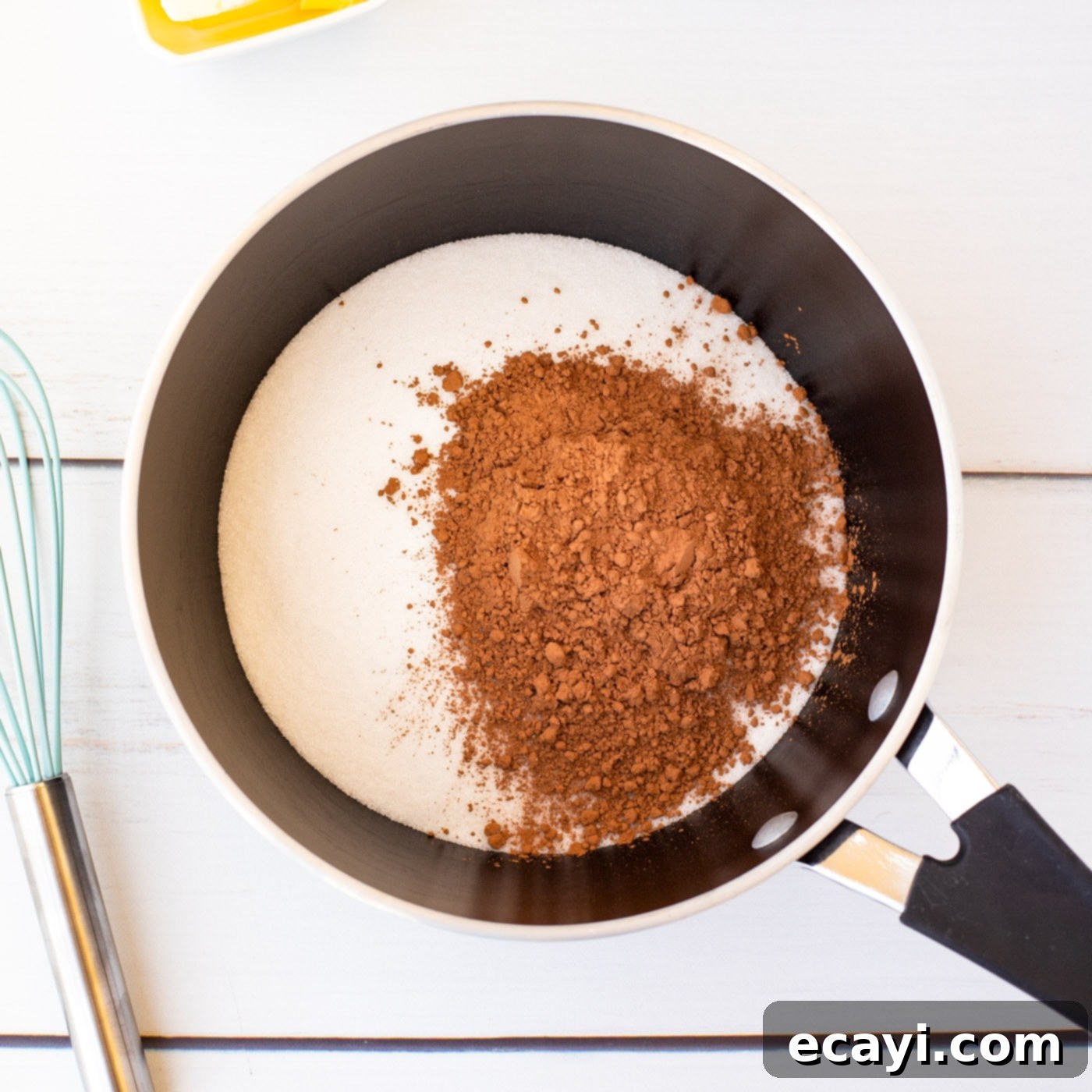Quick Chocolate No-Bake Delights 5 Granulated sugar and cocoa powder in a saucepan, ready to be whisked