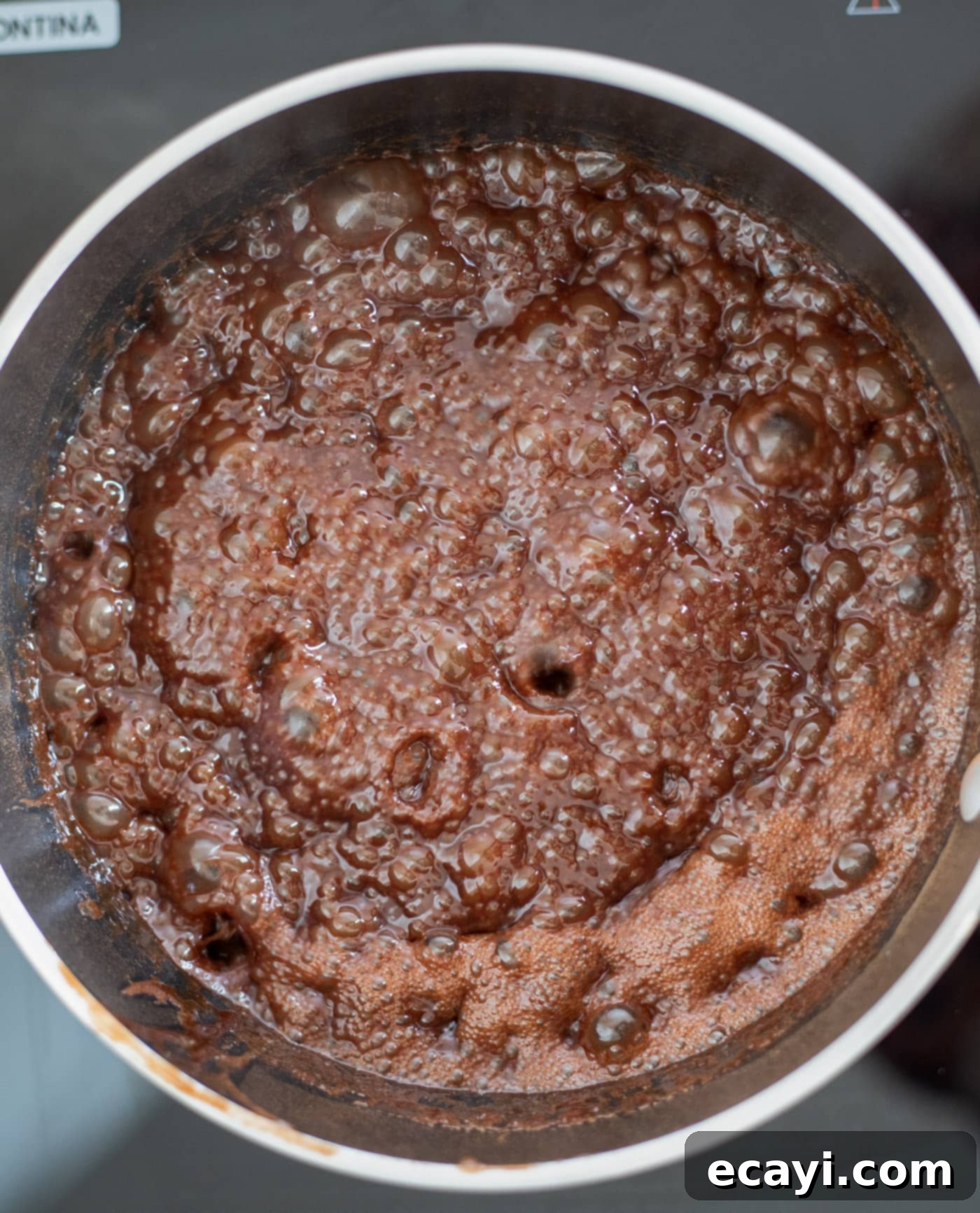 Quick Chocolate No-Bake Delights 8 Chocolate mixture boiling vigorously in a saucepan, showing a rolling boil