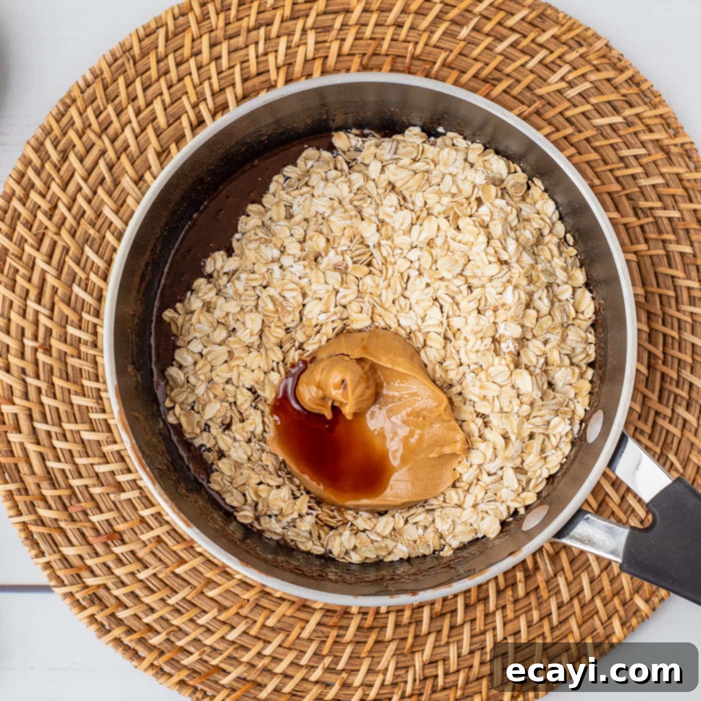 Quick Chocolate No-Bake Delights 9 Oats, peanut butter, and vanilla extract added on top of the hot chocolate mixture in the saucepan