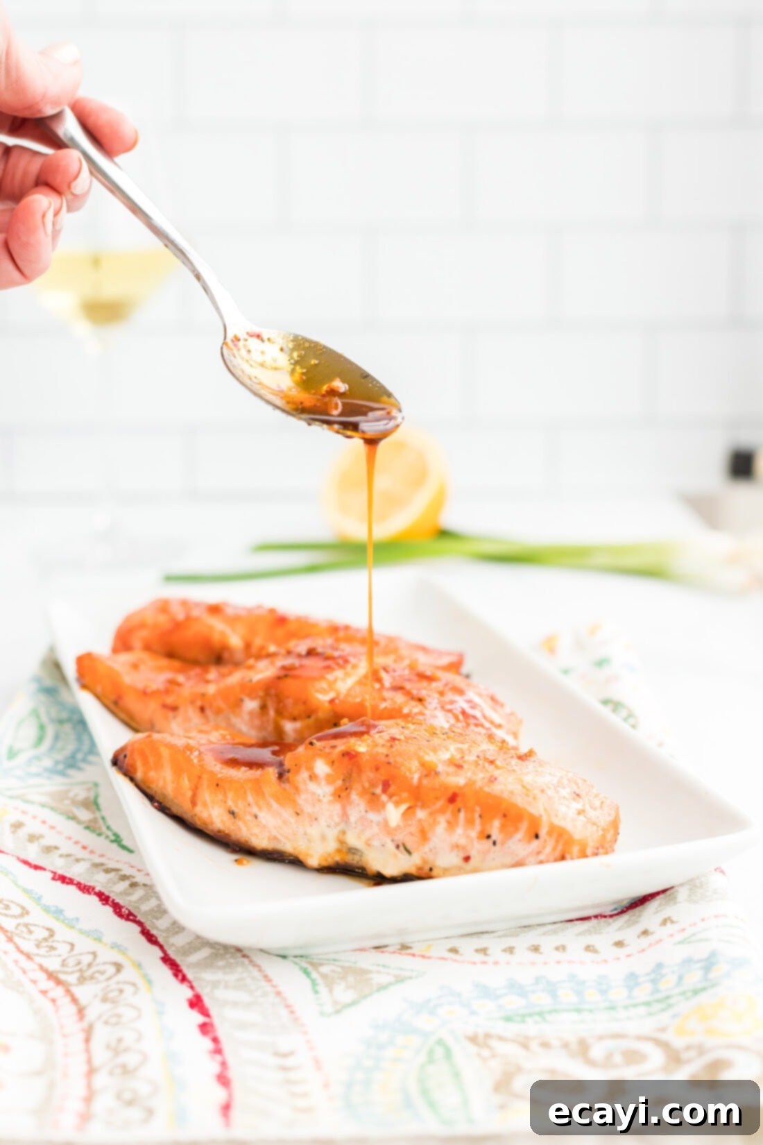 Sticky Maple Soy Salmon 2 drizzling sauce on Maple Soy Salmon