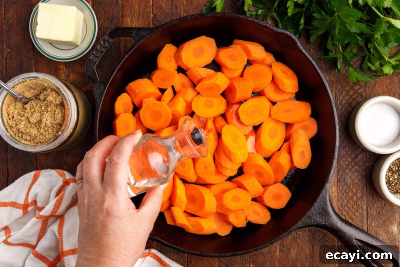 Sweet Glistening Carrots 5 adding water to a skillet full of sliced carrots