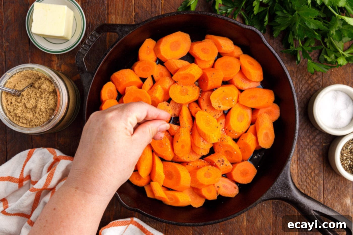 Sweet Glistening Carrots 6 adding salt and pepper to skillet with sliced carrots