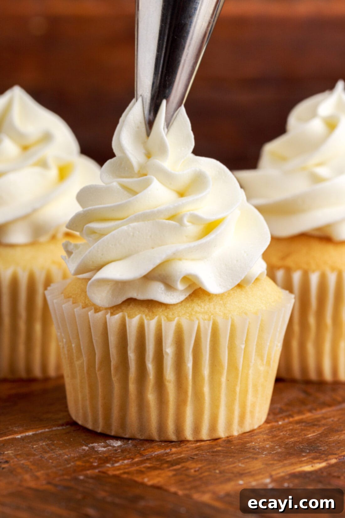 Silky Buttercream Dreams 2 piping Buttercream Frosting onto a cupcake