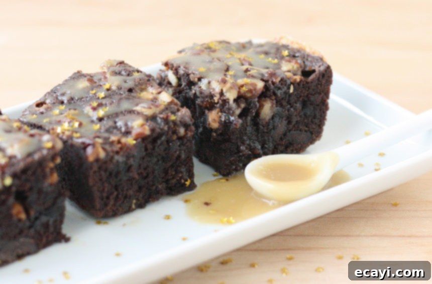 Gift Happiness With Homemade Brownie Jars 11 A freshly baked Chocolate, Pecan, and Butterscotch Brownie, cut into a perfect square, showcasing its delicious texture.