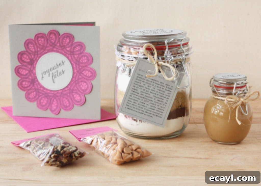 Gift Happiness With Homemade Brownie Jars 4 Clear glass jar filled with perfectly layered dry ingredients for a homemade brownie mix.