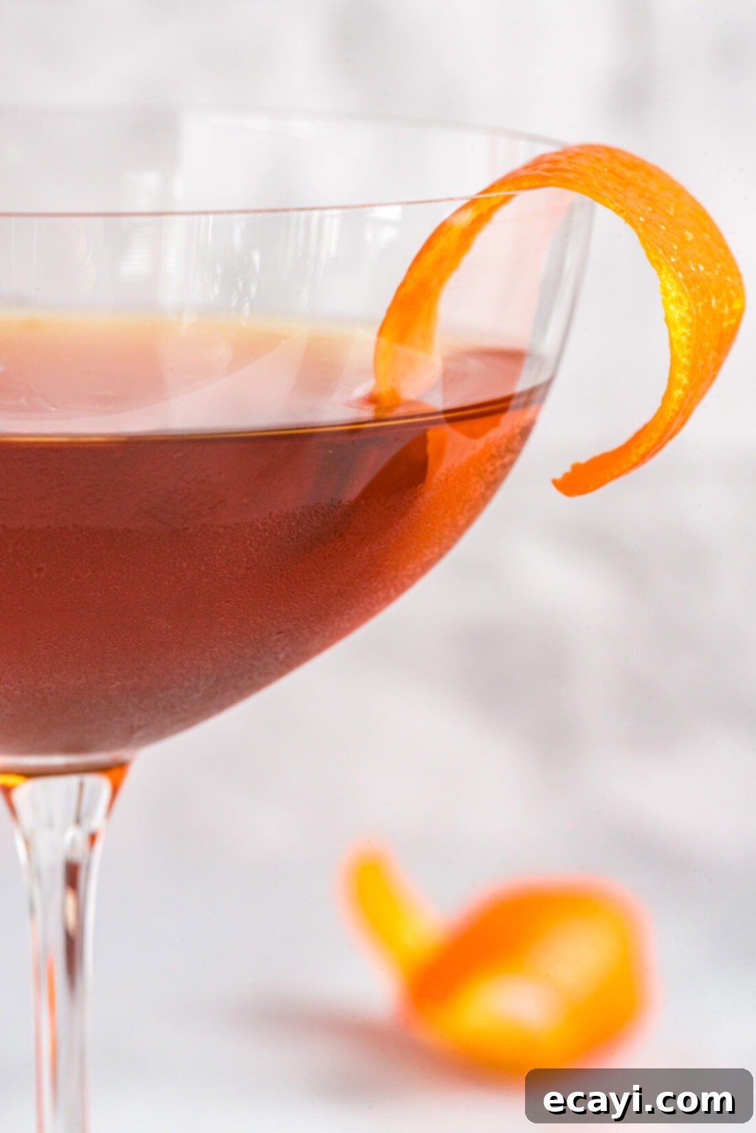 Manhattan's Signature Spirit 3 Close-up shot of a Manhattan Cocktail showcasing its rich amber hue and elegant cherry garnish.