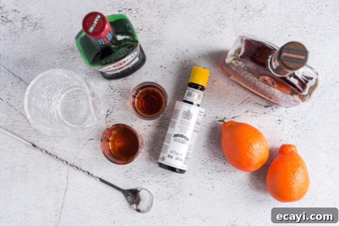 Manhattan's Signature Spirit 4 A selection of high-quality ingredients laid out to make a Manhattan Cocktail, including rye whiskey, sweet vermouth, and bitters.