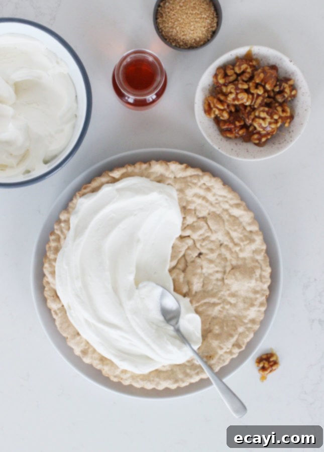 Maple Walnut Cream Tart 3 Close-up of a slice of Walnut and Maple Cream Tart, showing the meringue crust and fluffy maple cream