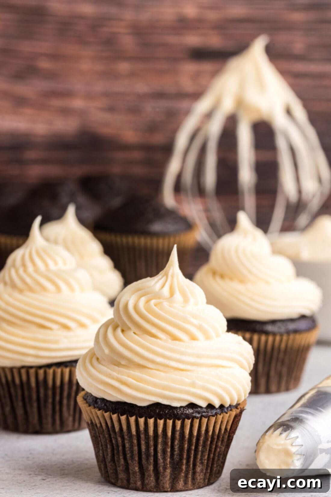 Luscious Cream Cheese Frosting 2 Cupcakes frosted with luxurious homemade cream cheese frosting, ready to be enjoyed.