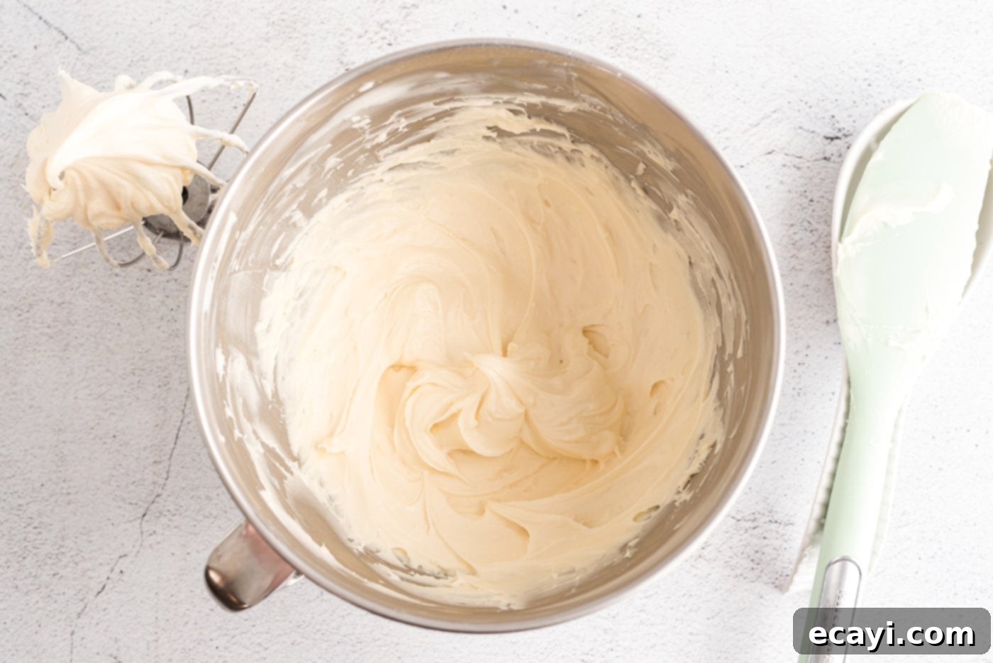 Luscious Cream Cheese Frosting 8 Smooth, creamy homemade cream cheese frosting resting in a mixing bowl, ready for use.