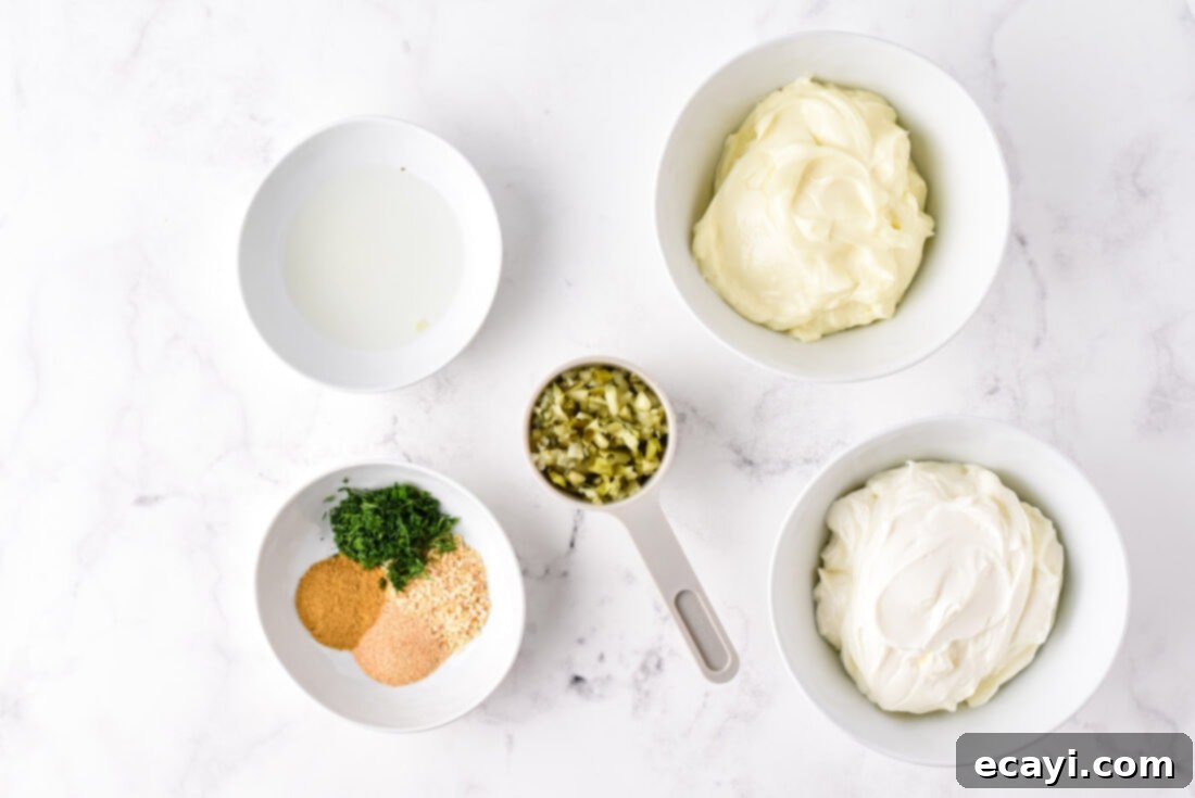 Dill Pickle Delight Dip 4 All the ingredients for Dill Pickle Dip laid out on a wooden surface
