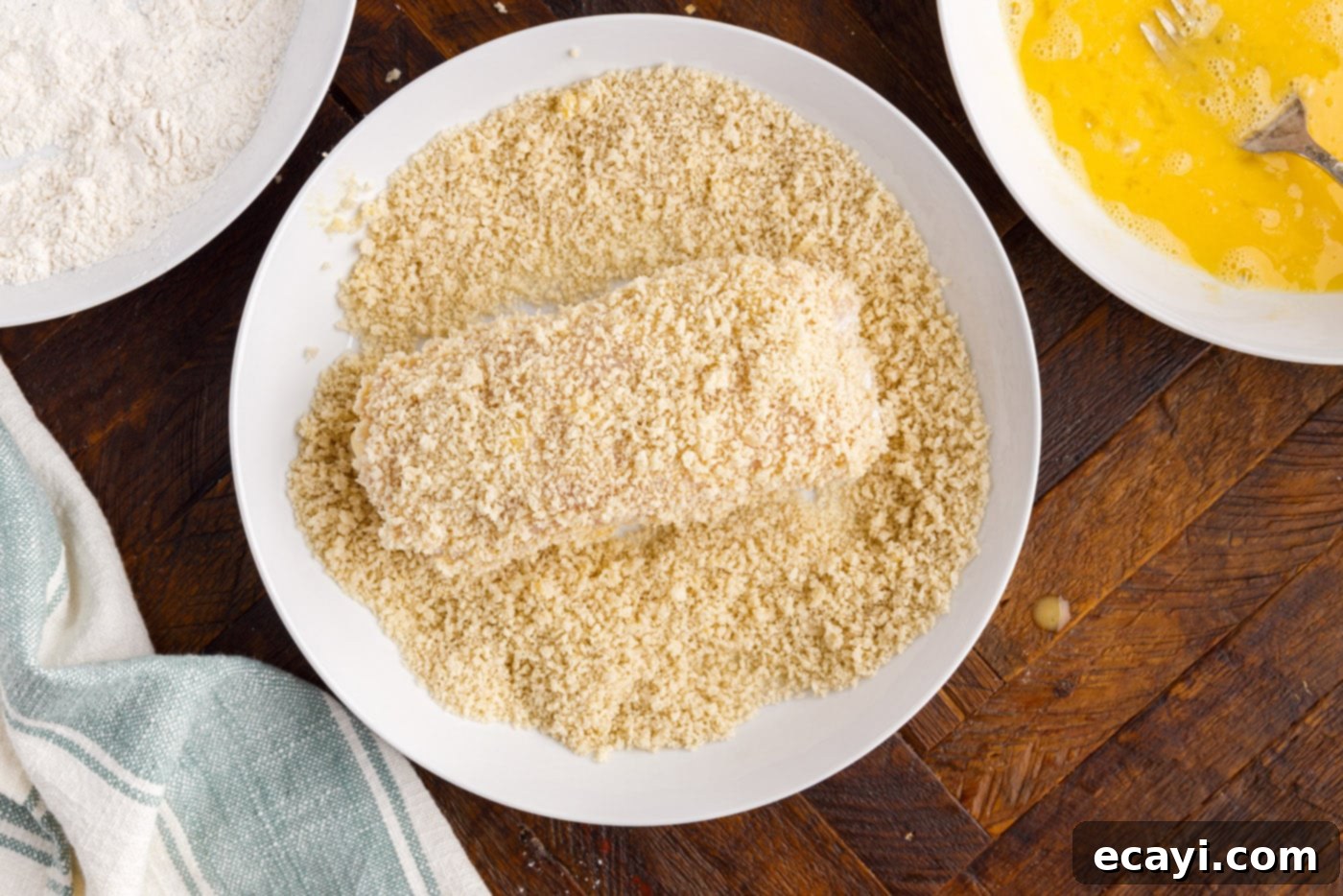 Gourmet Stuffed Chicken Rolls 11 Finishing the dredging process by coating rolled chicken in crispy Panko breadcrumbs